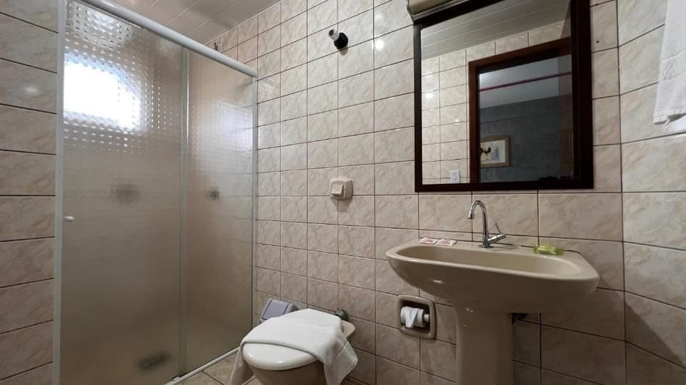 Shower, towels, soap, toilet paper