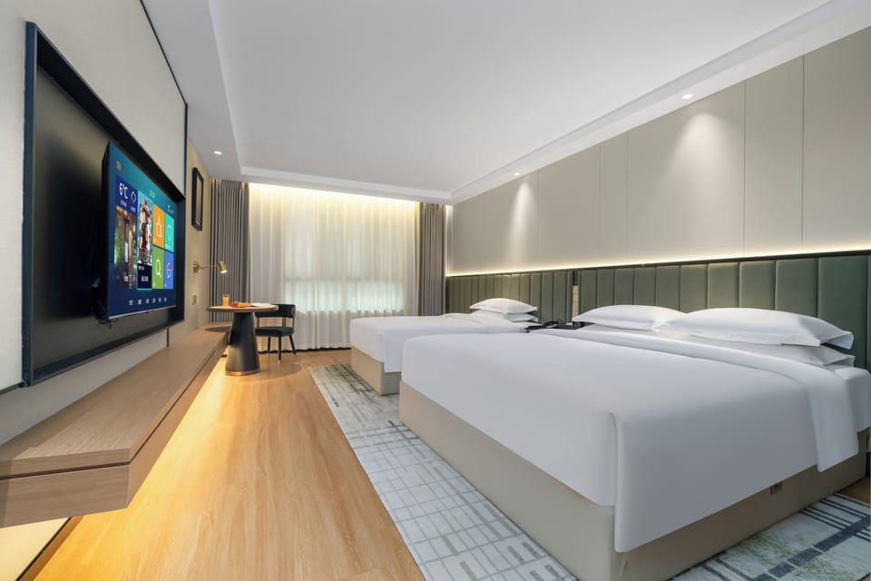 Premium bedding, memory foam beds, minibar (free items), desk