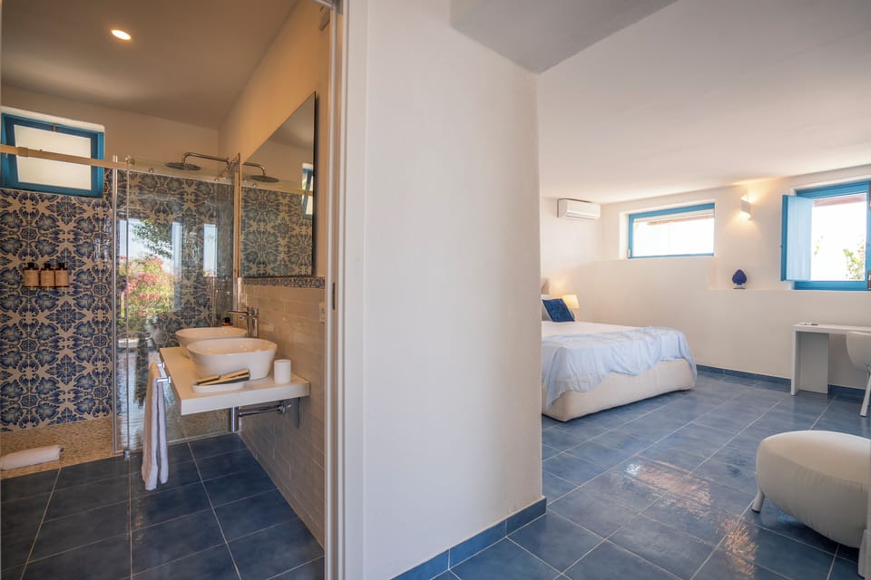 Romantic Suite, Sea View | Bathroom | Shower, hair dryer, slippers, towels