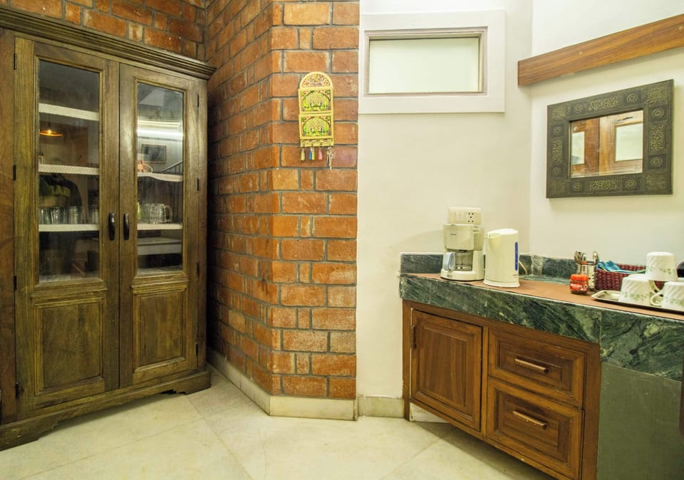 Standard Room, Ensuite, Garden View | Private kitchen | Electric kettle, dining table