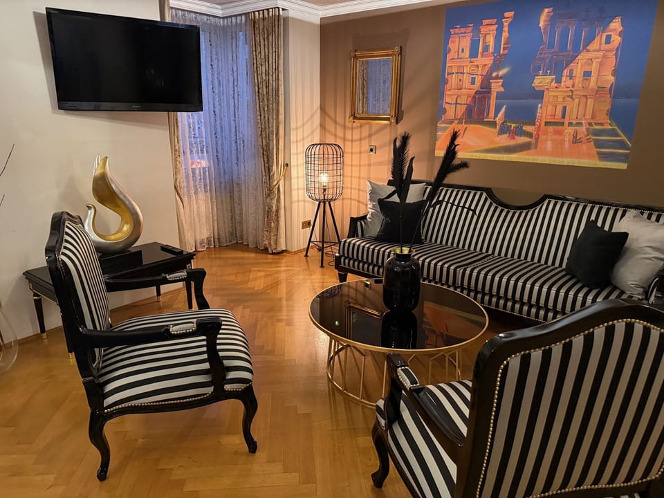 Deluxe Suite, Private Bathroom, City View | In-room safe, desk, blackout drapes, soundproofing