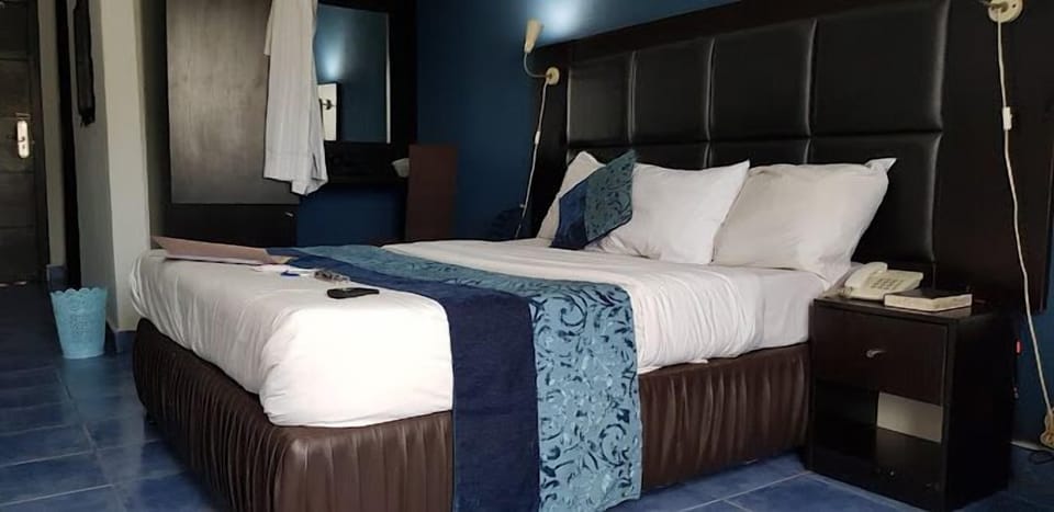 Deluxe Room, Balcony, City View | Desk, laptop workspace, blackout drapes, soundproofing
