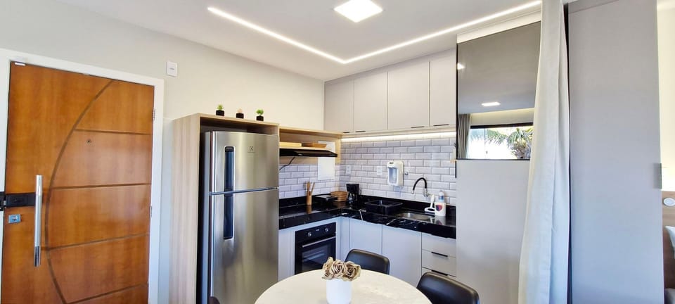 Panoramic Apartment | Private kitchen | Fridge, coffee/tea maker, cookware/dishes/utensils, dining tables