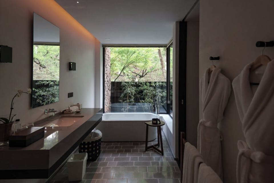 Exclusive Double Room, Balcony, Mountain View | Bathroom | Separate tub and shower, deep soaking tub, rainfall showerhead
