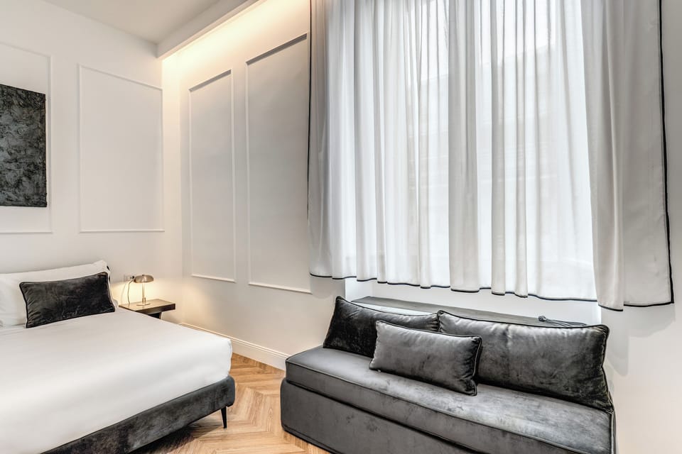 Deluxe Quadruple Room, City View | Desk, soundproofing, free WiFi