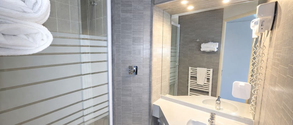 Shower, hair dryer, towels, soap