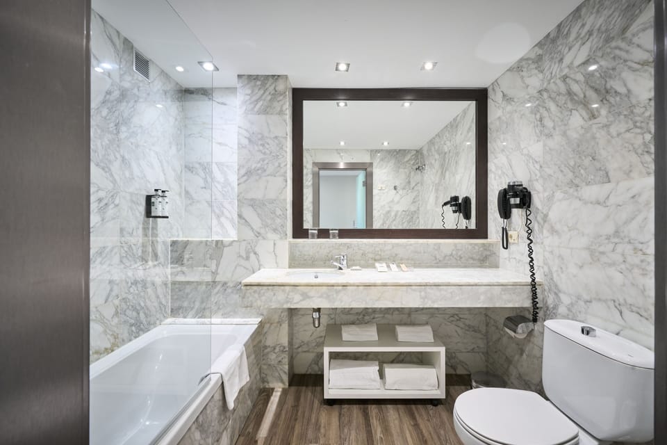 Eco-friendly toiletries, hair dryer, towels
