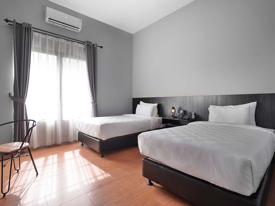 Superior Twin Room, Partial Sea View | In-room safe, desk, laptop workspace, iron/ironing board (on request)
