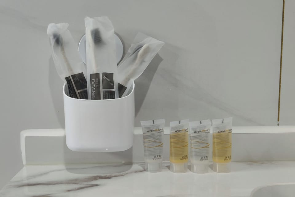 Deluxe Room | Bathroom | Shower, slippers, towels, soap