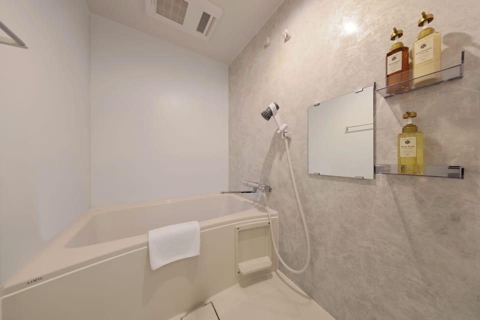 Condo, Non Smoking | Bathroom | Separate tub and shower, free toiletries, hair dryer, slippers