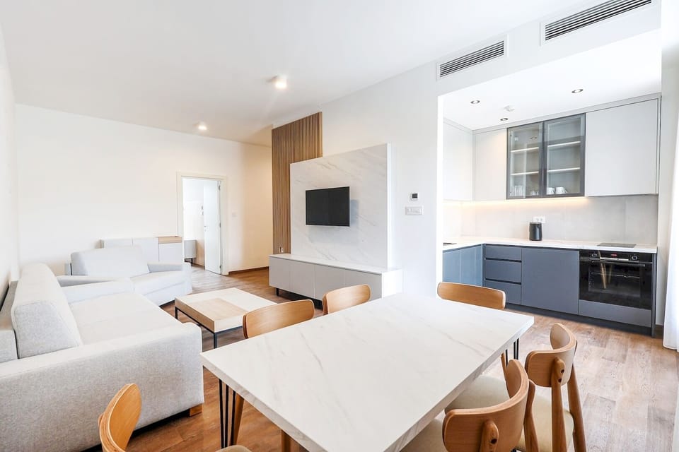 Deluxe Apartment | Living area | 40-inch LED TV with digital channels