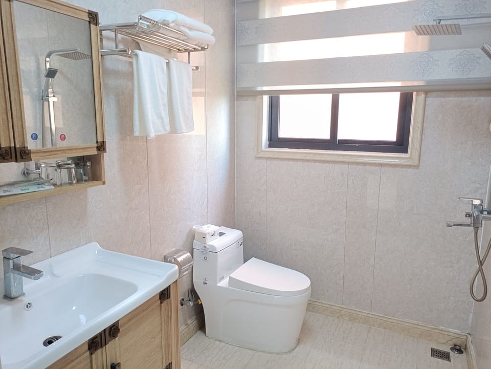Family Triple Room, Partial Ocean View | Bathroom | Shower, free toiletries, hair dryer, towels