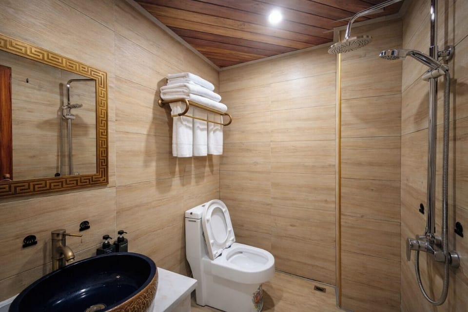 Shower, hair dryer, slippers, towels
