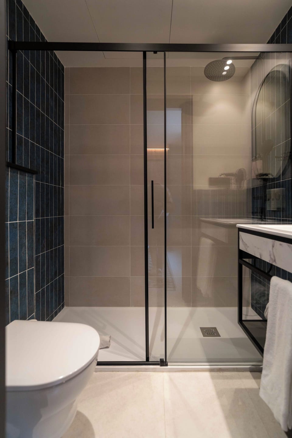 Shower, rainfall showerhead, towels, soap