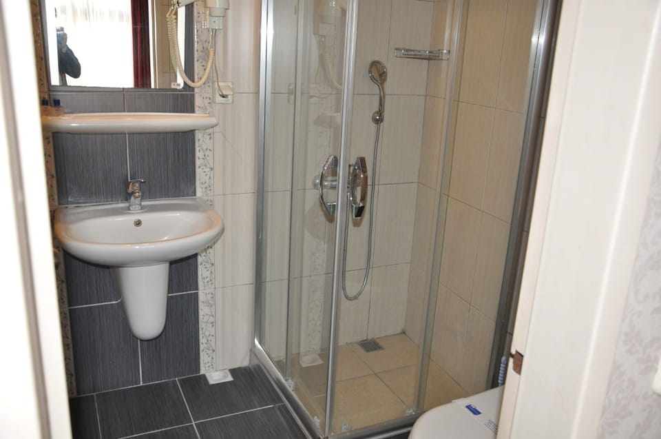 Separate tub and shower, deep soaking tub, hair dryer, slippers