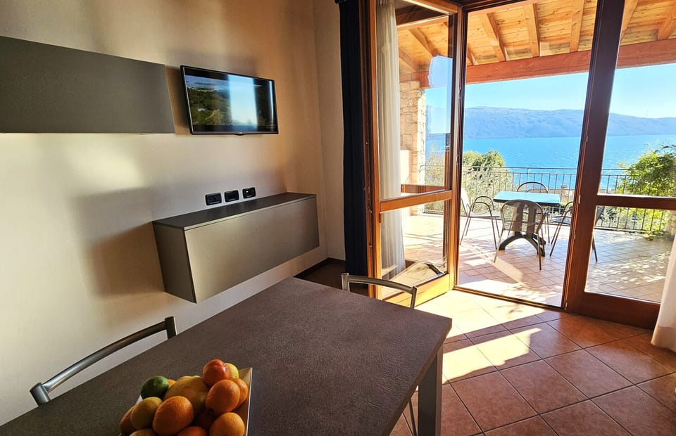 Apartment, Lake View | Living area | TV