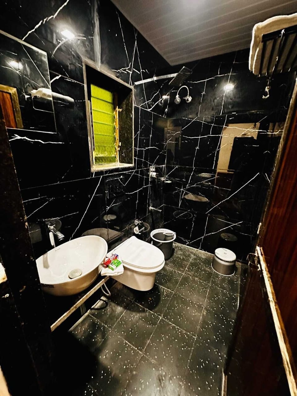 Shower, towels, soap, toilet paper