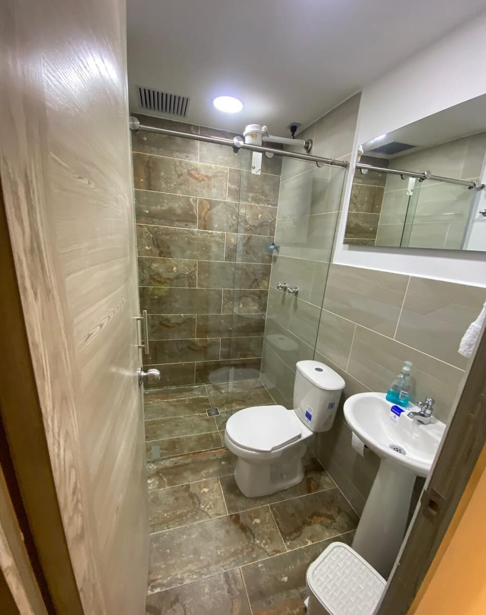 Shower, towels, soap, toilet paper