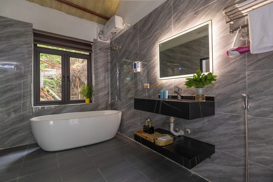 Rainfall showerhead, designer toiletries, hair dryer, slippers