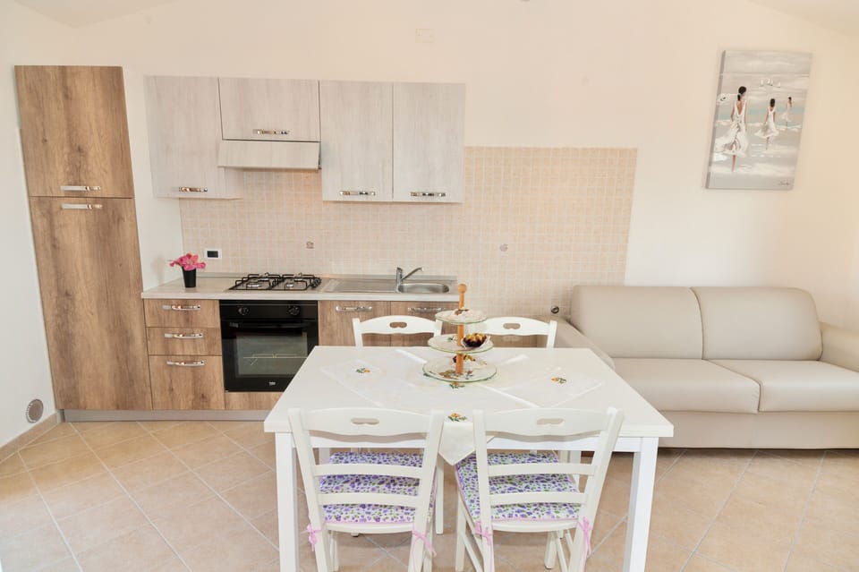 Apartment | Living area | 24-inch flat-screen TV with satellite channels