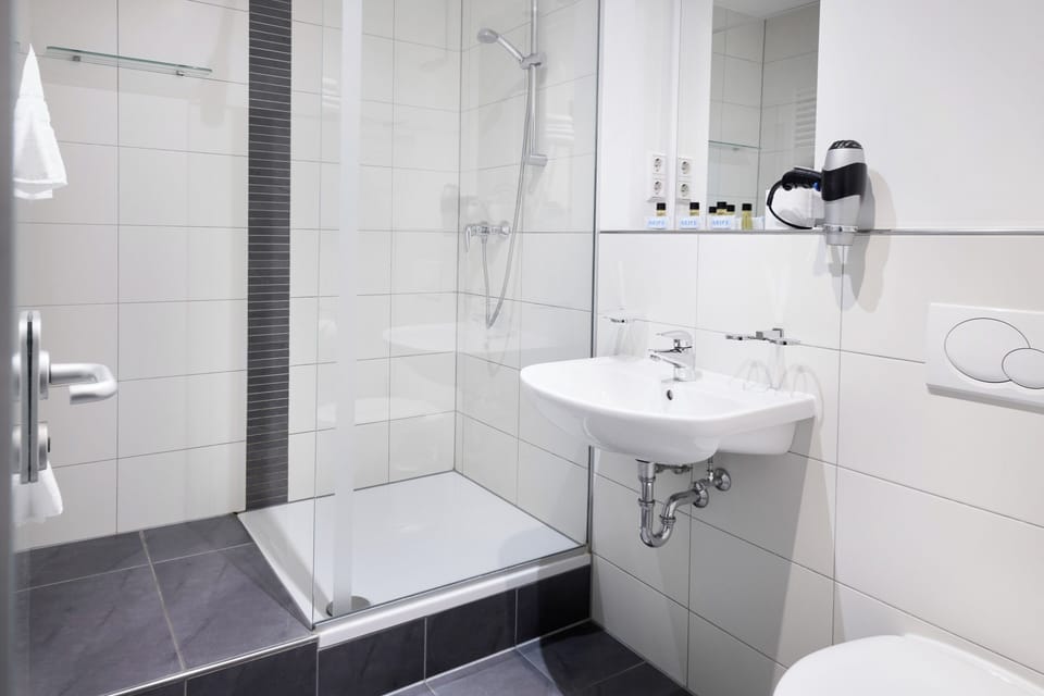 Eco-friendly toiletries, hair dryer, towels, soap