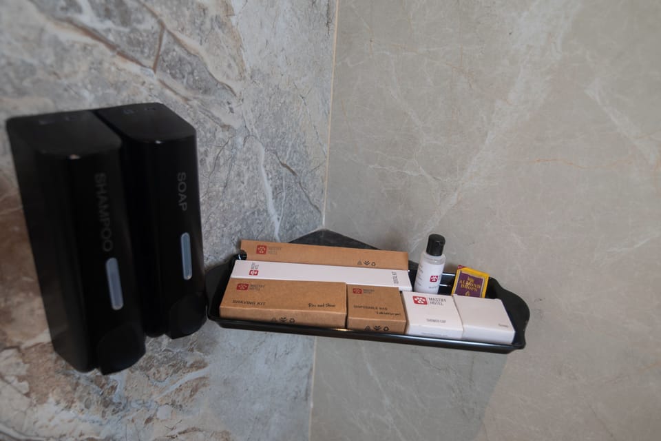 Premier Room | Bathroom | Shower, hair dryer, towels, soap