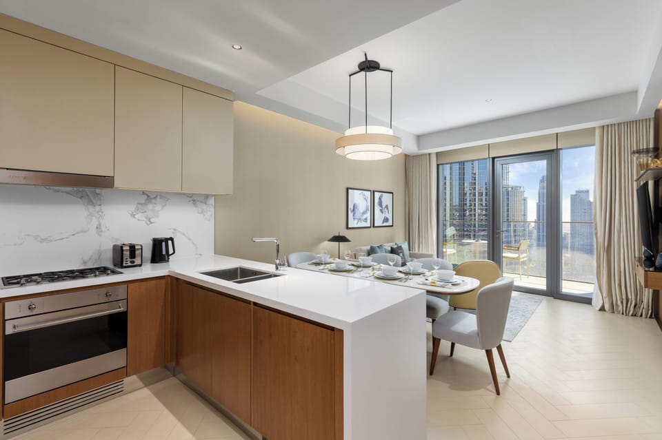 Deluxe Apartment, 2 Bedrooms, Balcony | Private kitchen | Coffee/tea maker, electric kettle, toaster, dining tables