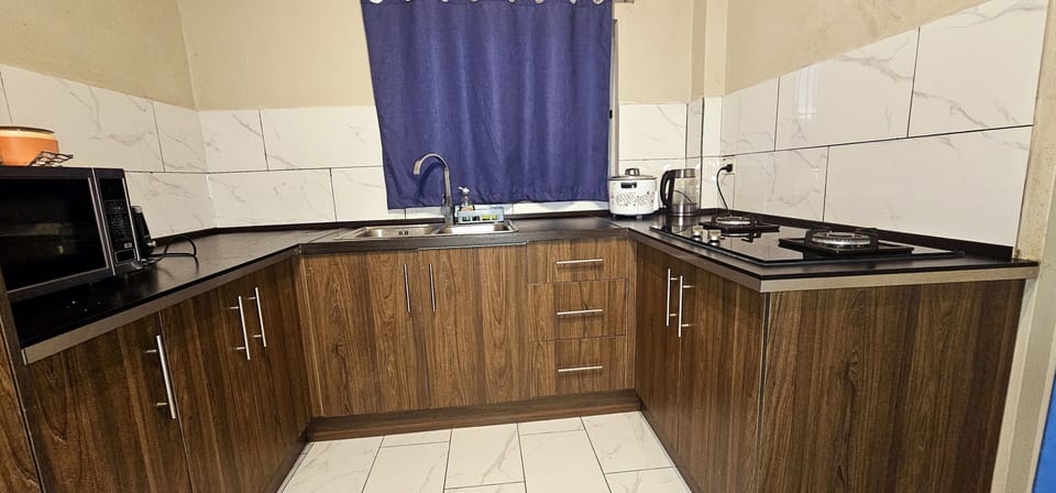 Apartment, 2 Bedrooms, Balcony | Private kitchen | Full-size fridge, microwave, stovetop, cookware/dishes/utensils