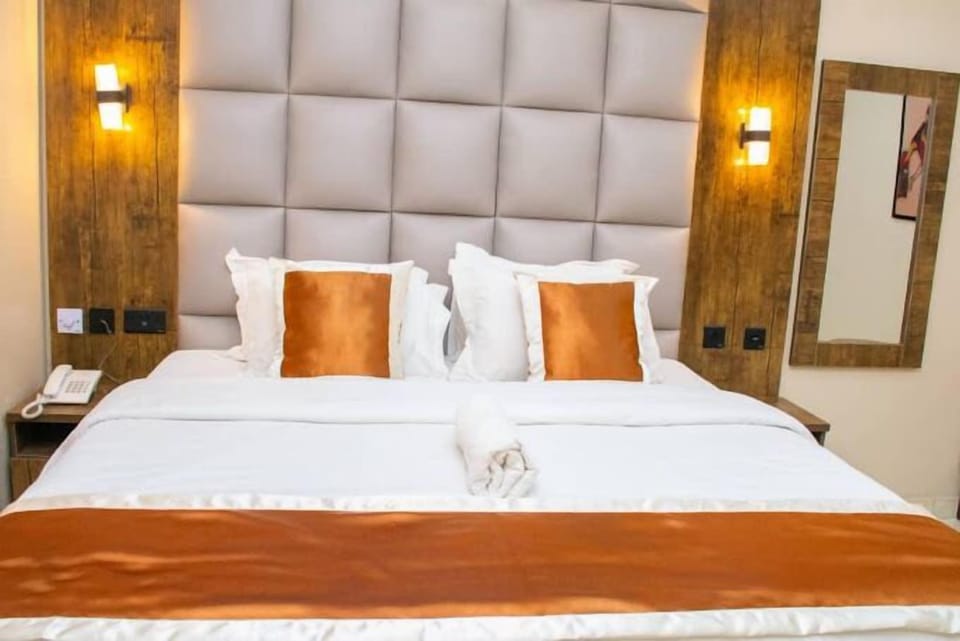 Deluxe Room, Balcony, City View | Desk, laptop workspace, blackout drapes, soundproofing