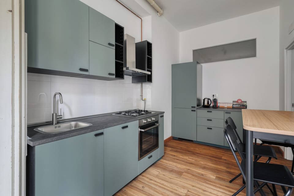 Apartment, 3 Bedrooms, Balcony | Private kitchen | Dishwasher, electric kettle, dining tables