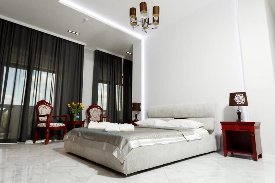 Deluxe Double Room, Balcony | In-room safe, desk, laptop workspace, blackout drapes