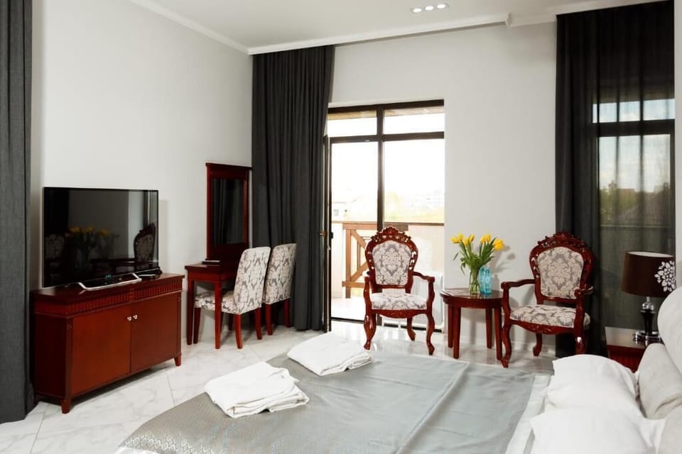 Deluxe Double Room, Balcony | In-room safe, desk, laptop workspace, blackout drapes