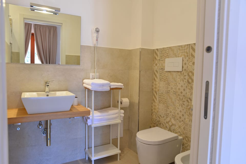 Standard Double or Twin Room, Balcony, Garden View | Bathroom | Shower, free toiletries, hair dryer, bidet
