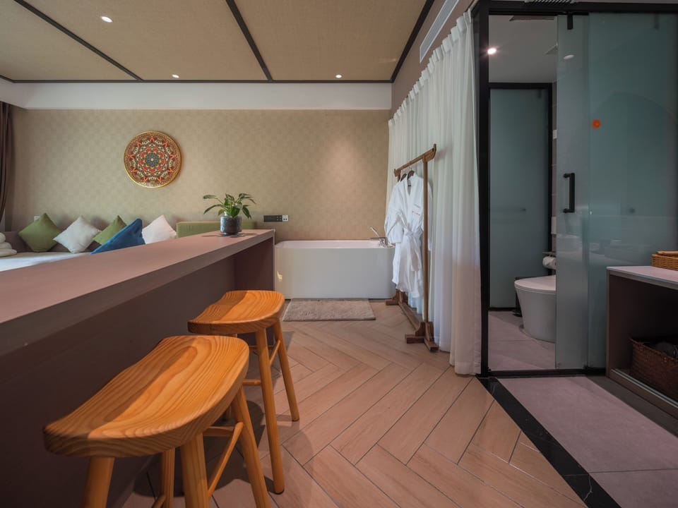 Deluxe Double Room, Garden View | Desk, blackout drapes, iron/ironing board, free WiFi