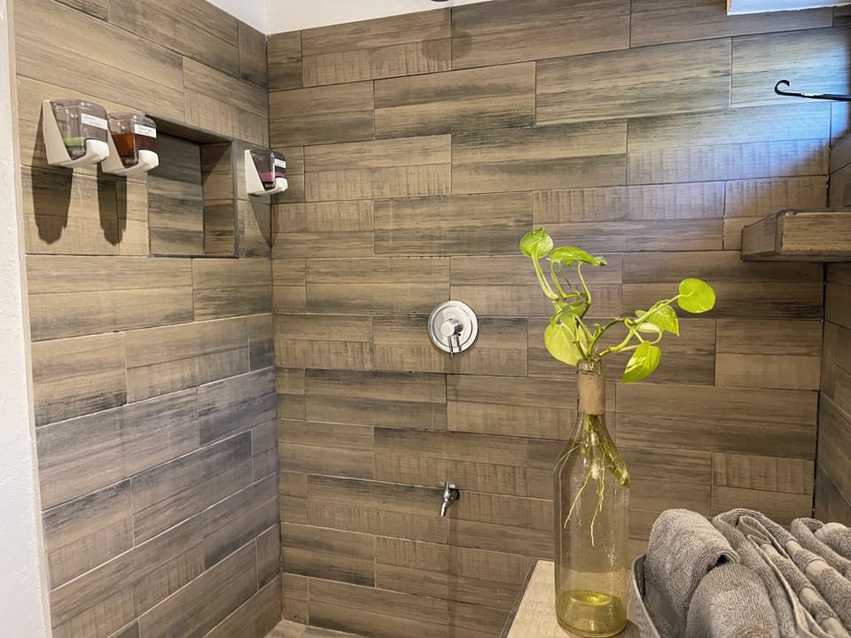 Room, Multiple Beds, Non Smoking, Partial Sea View | Bathroom | Shower, free toiletries, hair dryer, towels