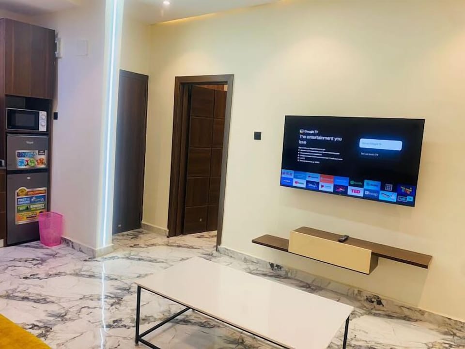 Family Apartment, Balcony, City View | Living area | Flat-screen TV