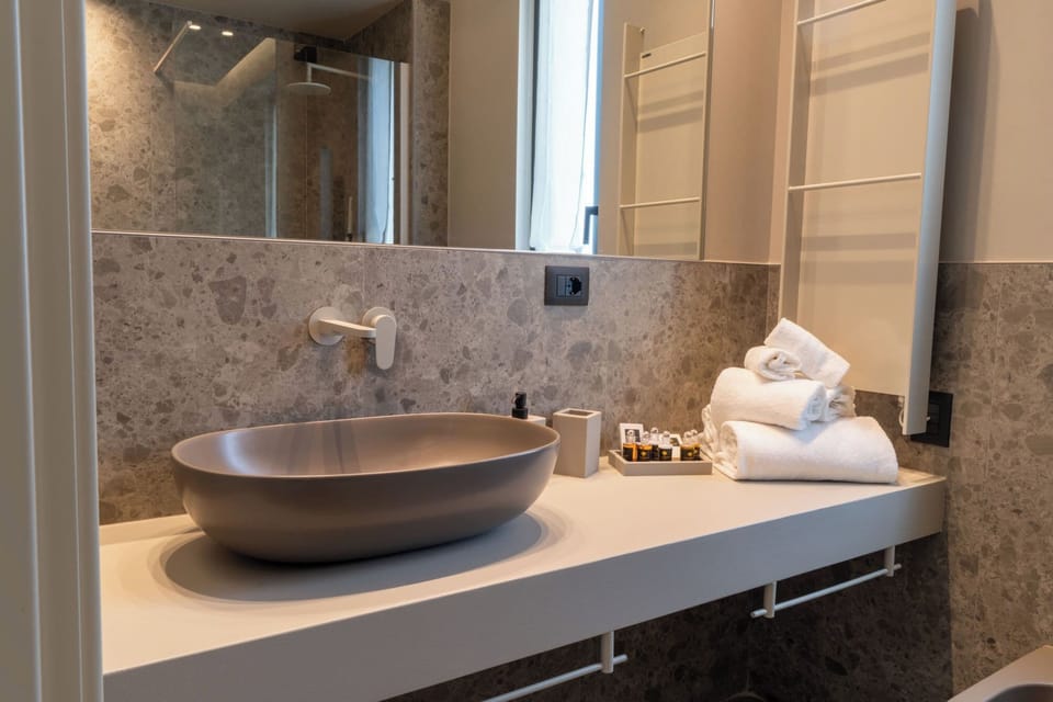 Junior Triple Room | Bathroom | Shower, hair dryer, slippers, towels