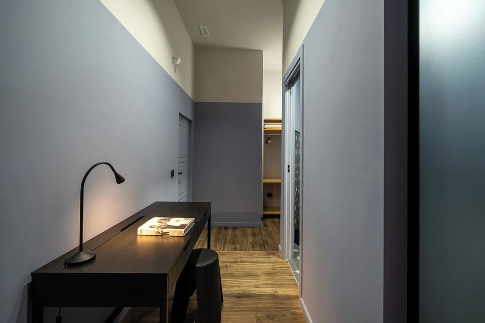 Deluxe Triple Room, Balcony | In-room safe, desk, laptop workspace, blackout drapes