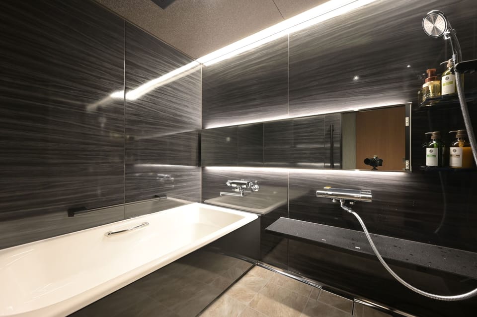 Japanese-style Quadruple Room | Bathroom | Combined shower/tub, hair dryer, slippers, bidet