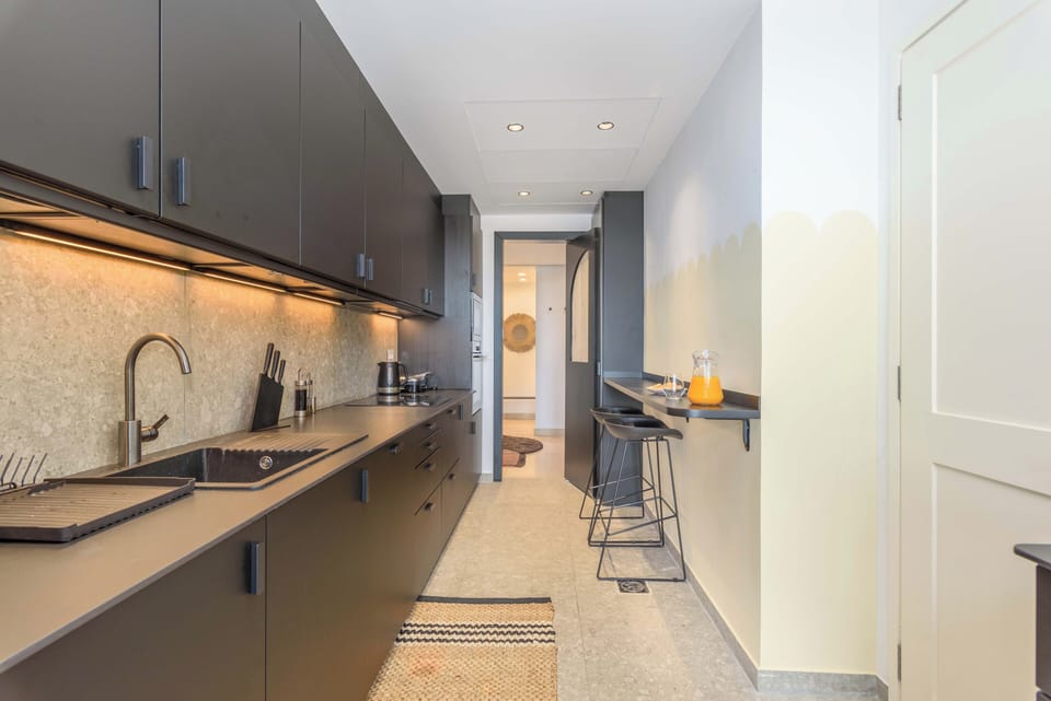 Apartment, 2 Bedrooms, City View, Courtyard Area | Private kitchen | Coffee/tea maker, fridge, microwave, oven