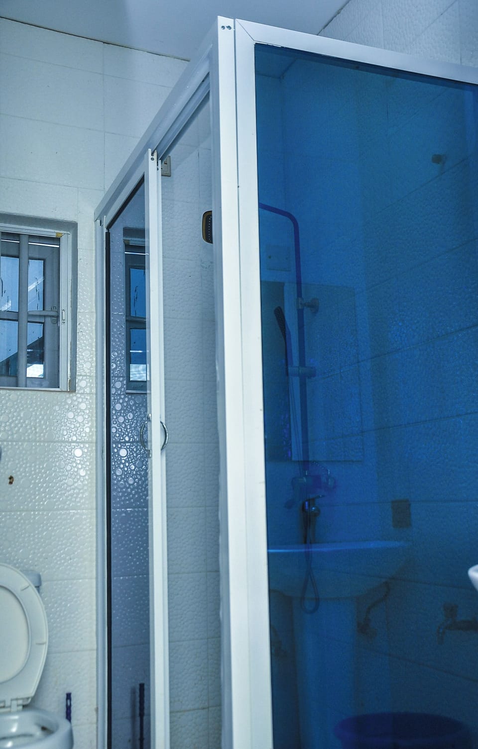 Shower, slippers, towels, soap