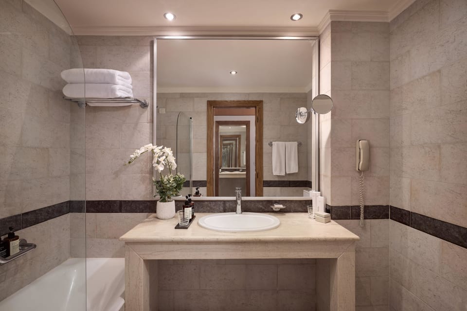 Duplex, Partial Sea View | Bathroom | Free toiletries, hair dryer, bathrobes, slippers