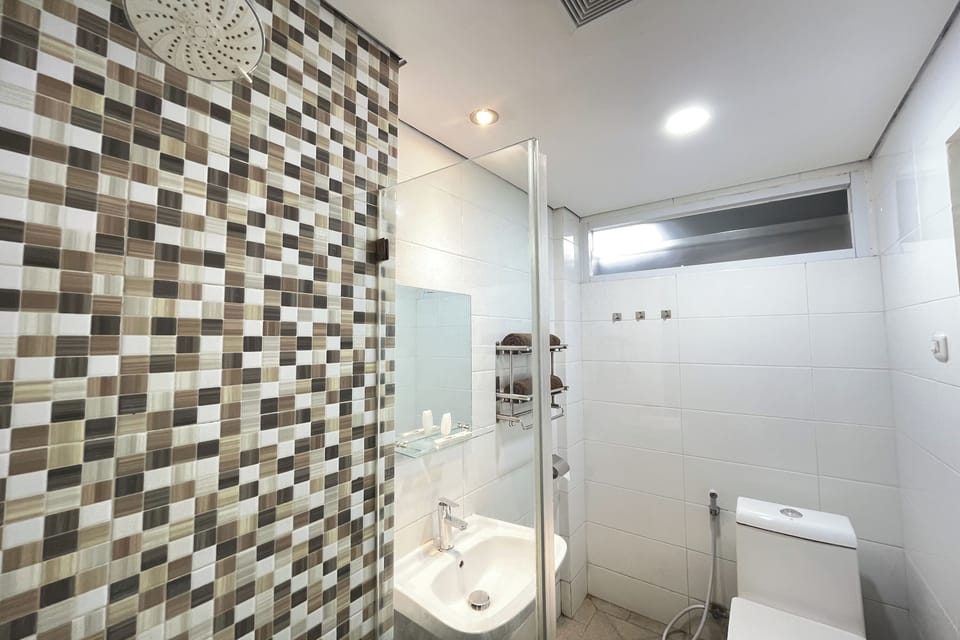 Shower, free toiletries, slippers, towels