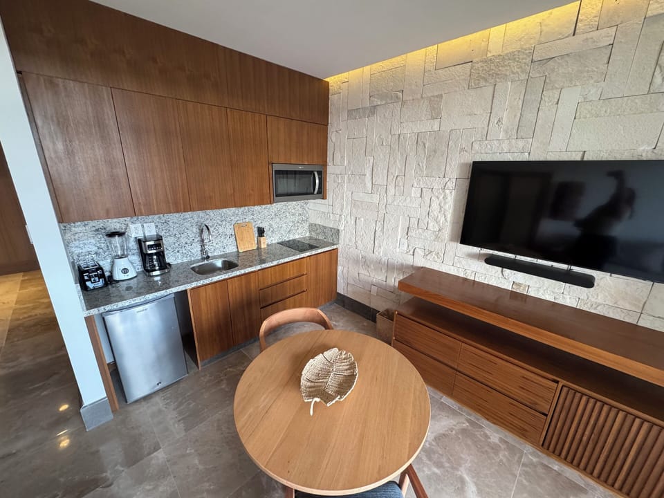 Presidential Suite | Living area | 55-inch flat-screen TV with cable channels, foosball, table tennis