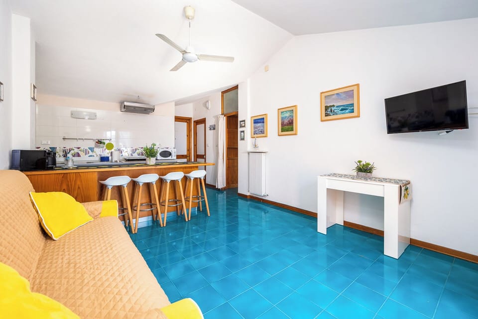 Panoramic Apartment, Partial Sea View | Living area | 30-inch flat-screen TV with digital channels
