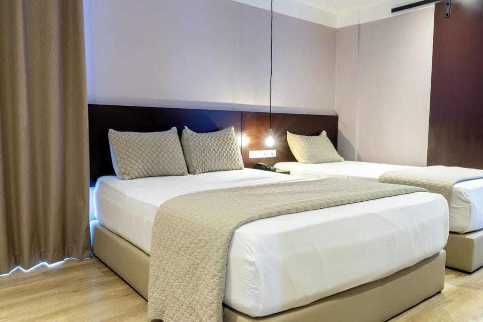 Deluxe Triple Room | Premium bedding, Select Comfort beds, iron/ironing board, free WiFi