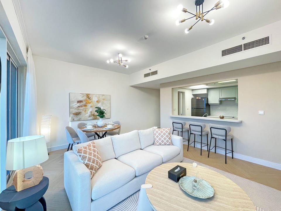 Premium Apartment, 2 Bedrooms, Lake View | Living room | 55-inch Smart TV with cable channels