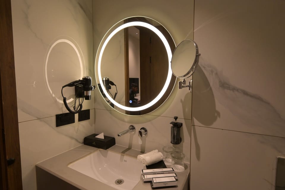 Deluxe Room, City View | Bathroom | Shower, slippers, soap, shampoo