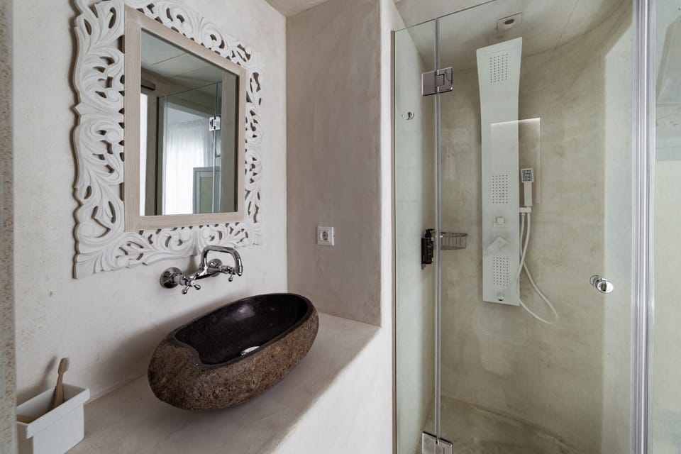 Shower, hair dryer, slippers, towels