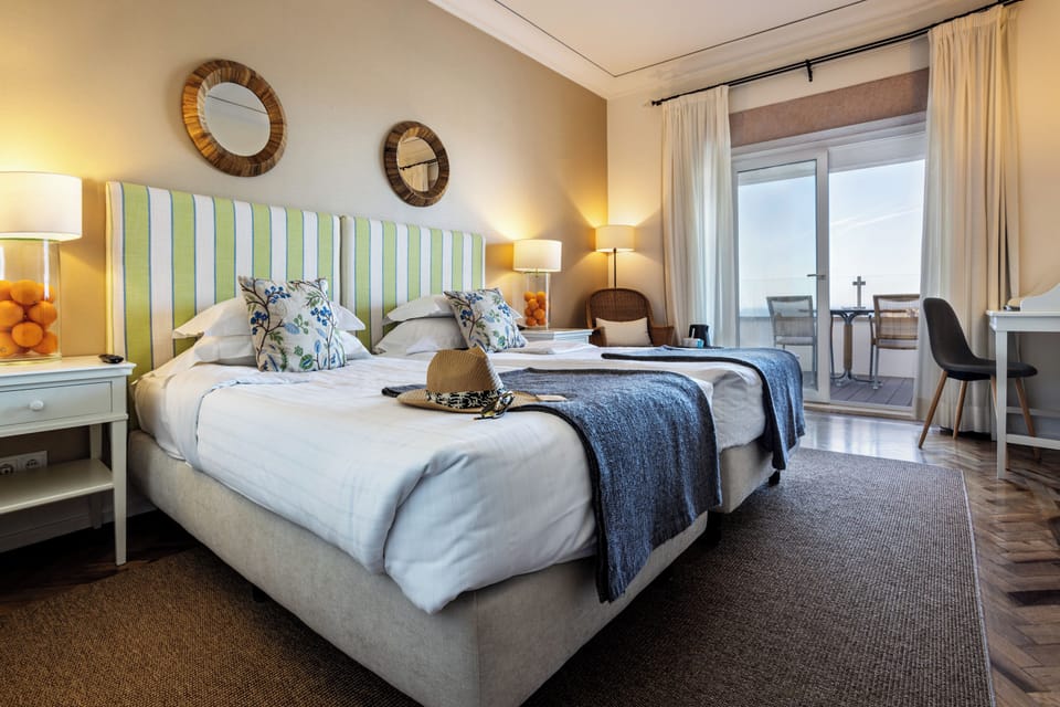 Superior Double or Twin Room, Sea View | Minibar, in-room safe, desk, blackout drapes